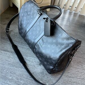 Louis Vuitton Black Duffel Bag with Iconic Design